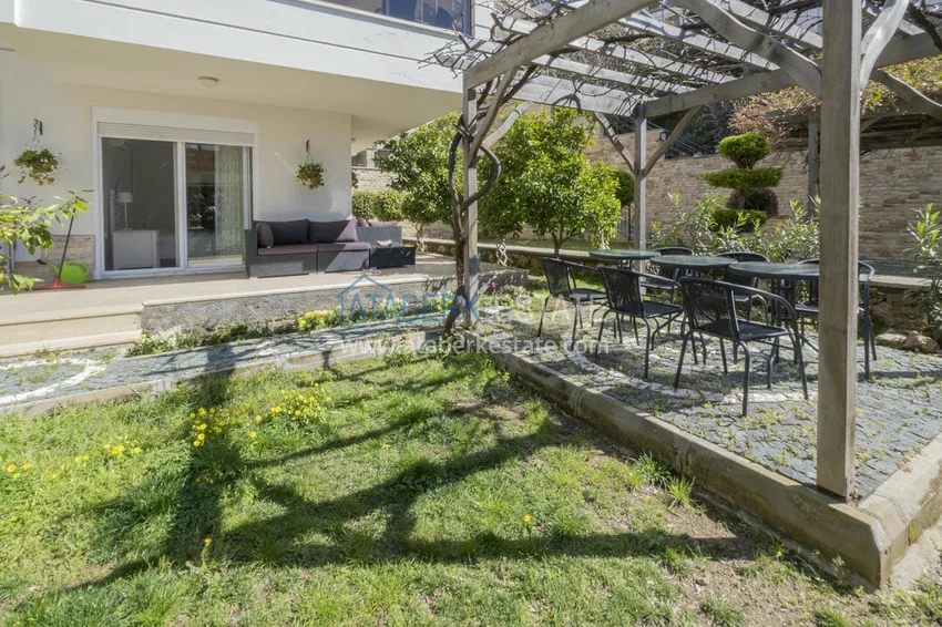 Приобрести Меблированный садовый дуплекс с двумя спальнями, застекленным балконом и видом на море в Алании 5 