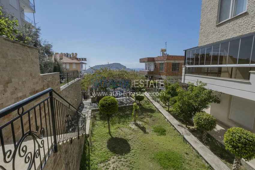 Меблированный садовый дуплекс с двумя спальнями, застекленным балконом и видом на море в Алании 5 