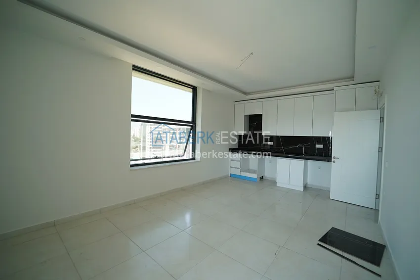 Приобрести Квартиры и пентхаусы с чистовой отделкой различных планировок в районе Махмутлар – Новостройка  14 