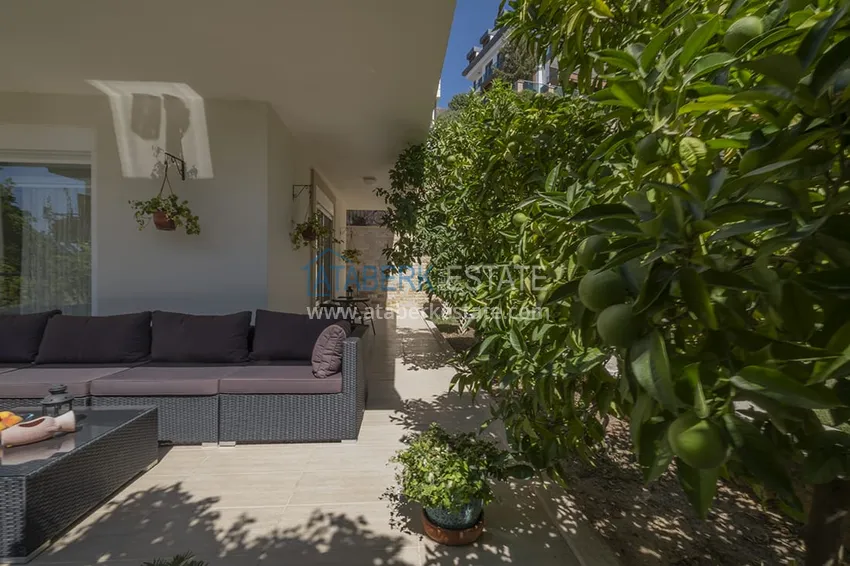 Приобрести Меблированный садовый дуплекс с двумя спальнями, застекленным балконом и видом на море в Алании 8 