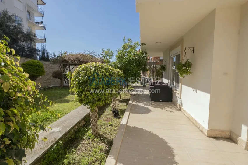 Приобрести Меблированный садовый дуплекс с двумя спальнями, застекленным балконом и видом на море в Алании 9 