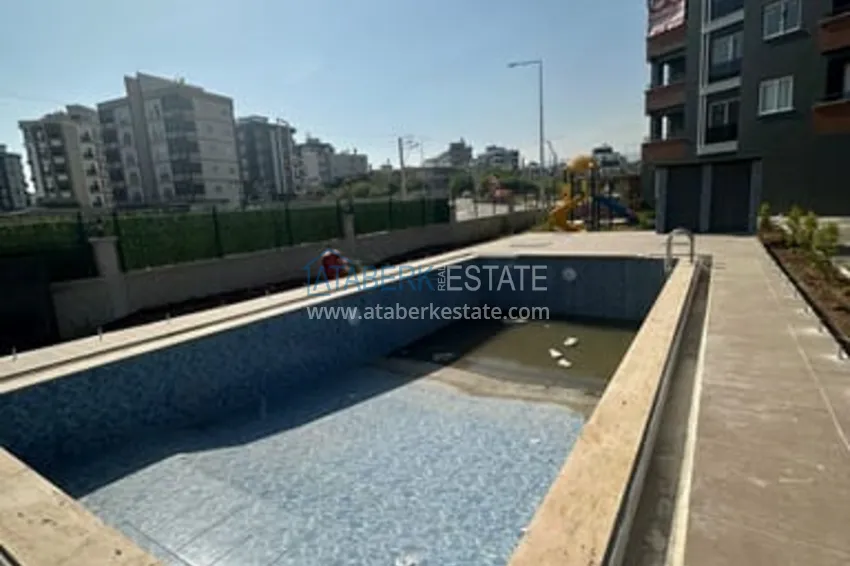 Квартира 2+1 с чистовой отделкой в жилом комплексе с инфраструктурой Мезитли-Мерсин 2 