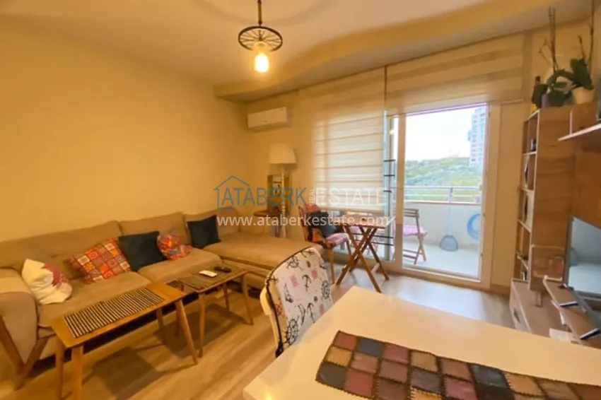 Приобрести Меблированная двухкомнатная квартира в районе Енишехир-Мерсин 1 