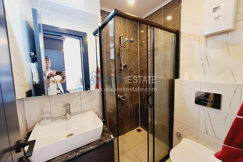 Приобрести Двухкомнатная квартира с современным интерьером в Алании, район Оба 11 