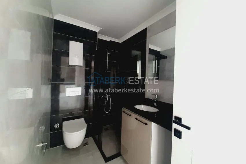 Приобрести Двухкомнатная квартира с чистовой отделкой в новом комплексе – Алания, район Авсаллар 12 