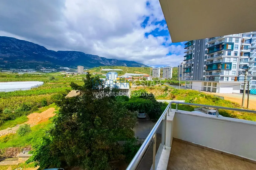 Приобрести Просторная трехкомнатная квартира с видом на море и горы в районе Махмутлар, Алания  25 