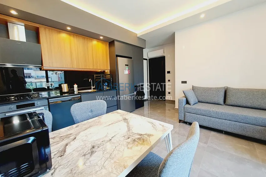 Приобрести Двухкомнатная квартира с современным интерьером в Алании, район Оба 3 