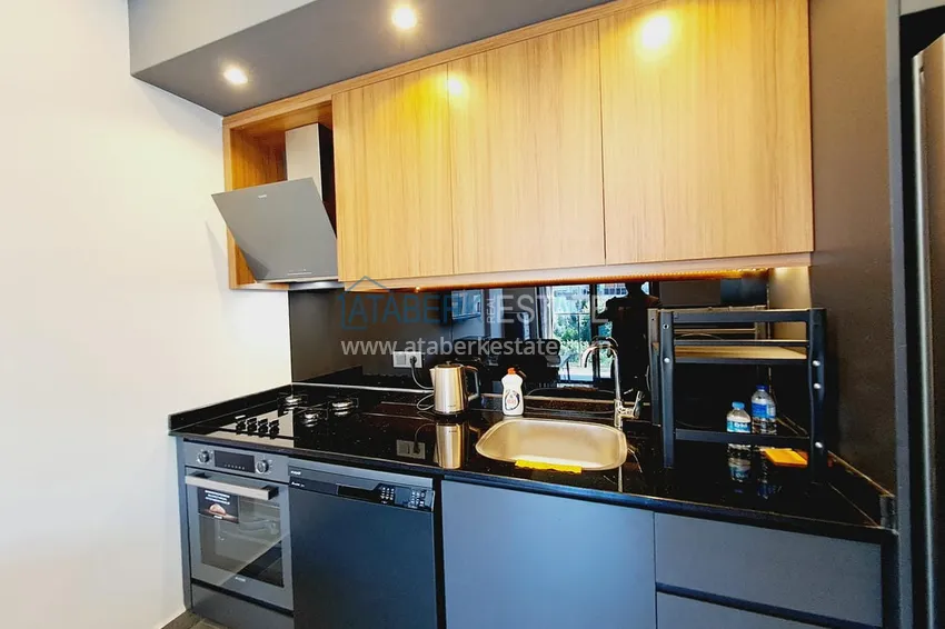 Приобрести Двухкомнатная квартира с современным интерьером в Алании, район Оба 4 