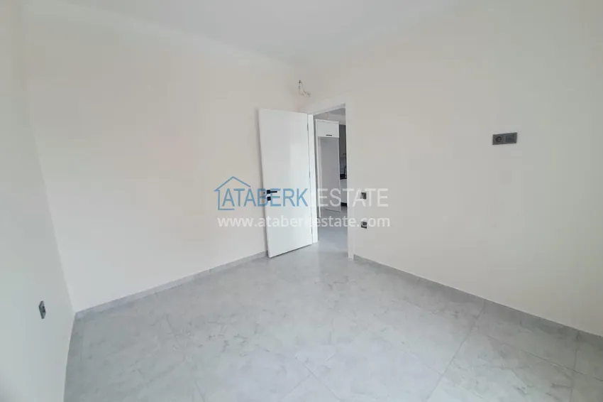 Приобрести Двухкомнатная квартира с чистовой отделкой в новом комплексе – Алания, район Авсаллар 7 