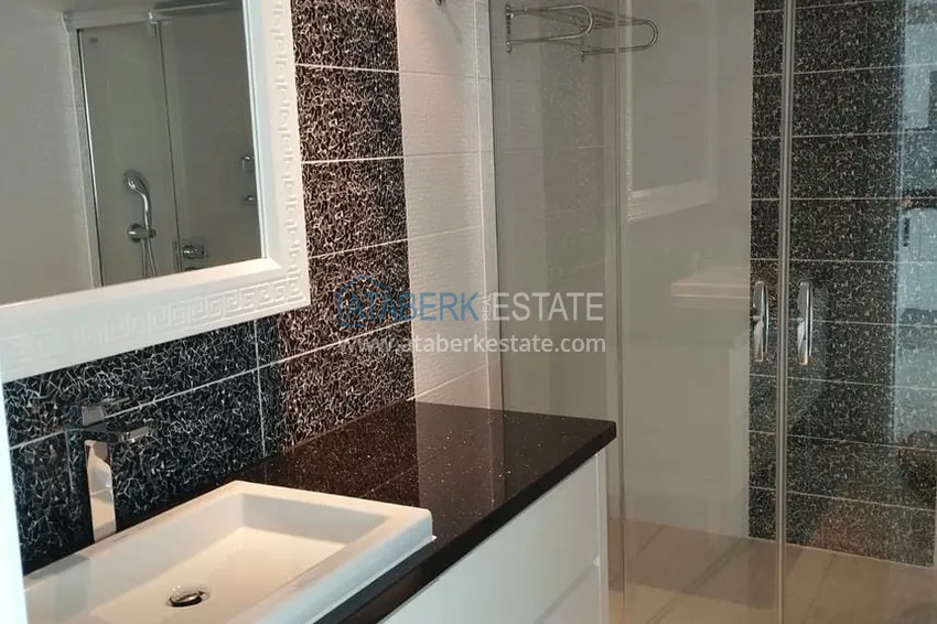 Приобрести Просторная двухкомнатная квартира с панорамным видом на море напрямую от владельца в Алании - район Конаклы 9