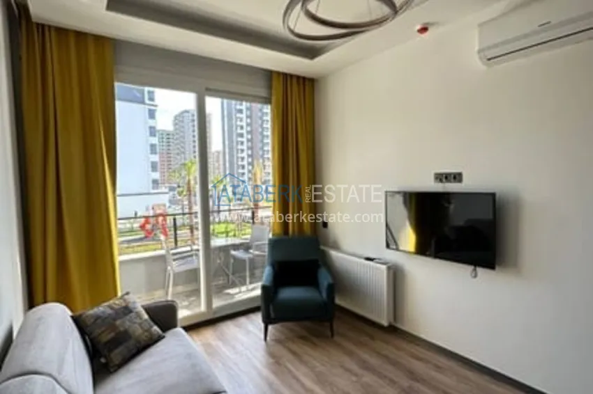 Приобрести Квартира 1+1 меблированная в новом жилом комплексе в районе Арпачбахшиш-Мерсин 3 