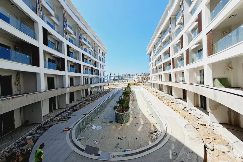 Фото -  Двухкомнатная квартира 85 м2 в строящемся комплекс-отеле в Алании, район Тюрклер 11 