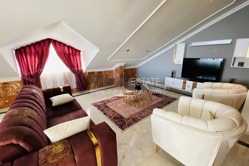 Приобрести Роскошный видовой дуплекс с дизайнерским ремонтом и новой мебелью на первой береговой в Махмутларе, Алания 18 