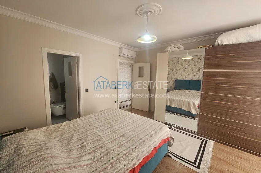 Приобрести Линейная четырехкомнатная квартира с отдельной кухней в районе Джикджилли, Алания 13 