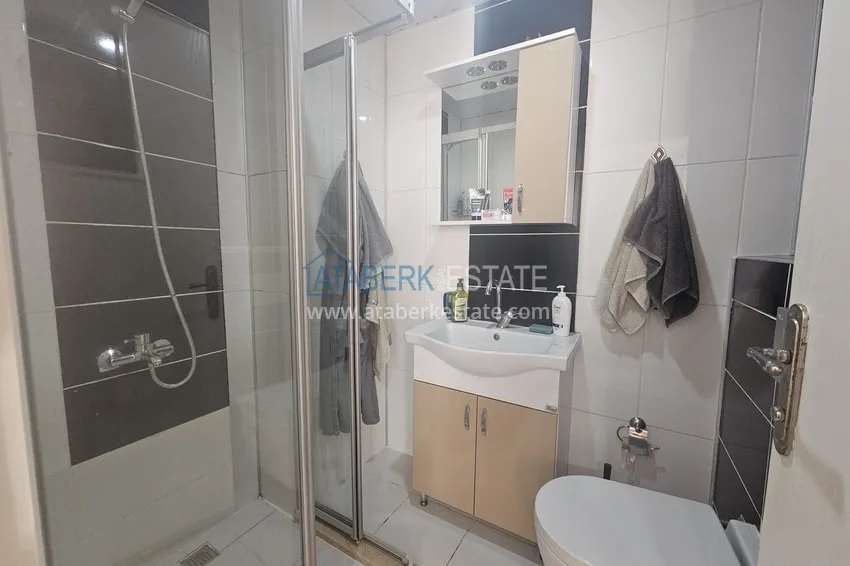 Приобрести Линейная четырехкомнатная квартира с отдельной кухней в районе Джикджилли, Алания 18 