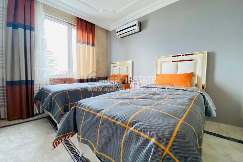 Приобрести Роскошный видовой дуплекс с дизайнерским ремонтом и новой мебелью на первой береговой в Махмутларе, Алания 23 