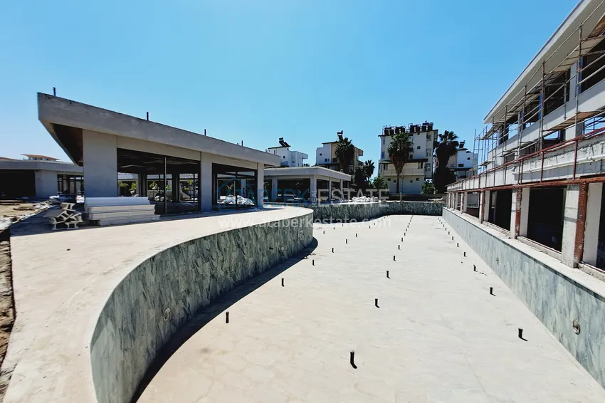 Фото - Современные апартаменты в роскошном комплексе с отельной инфраструктурой – Алания, район Тюрклер 19