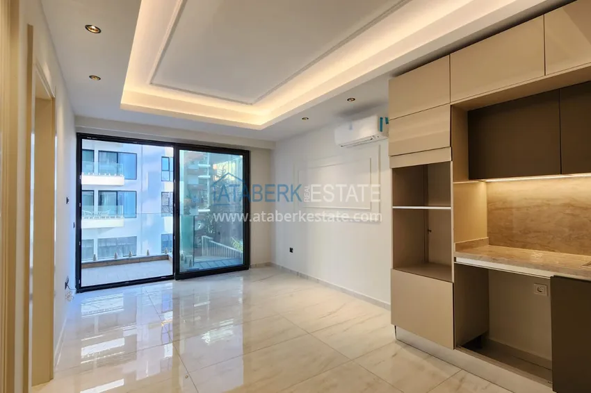 Приобрести Квартира с чистовой отделкой на первой береговой линии - Алания, район Махмутлар 3 