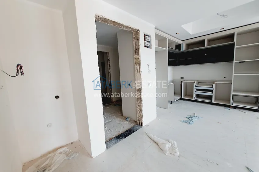 Приобрести Двухкомнатная квартира 85 м2 в строящемся комплекс-отеле в Алании, район Тюрклер 2 