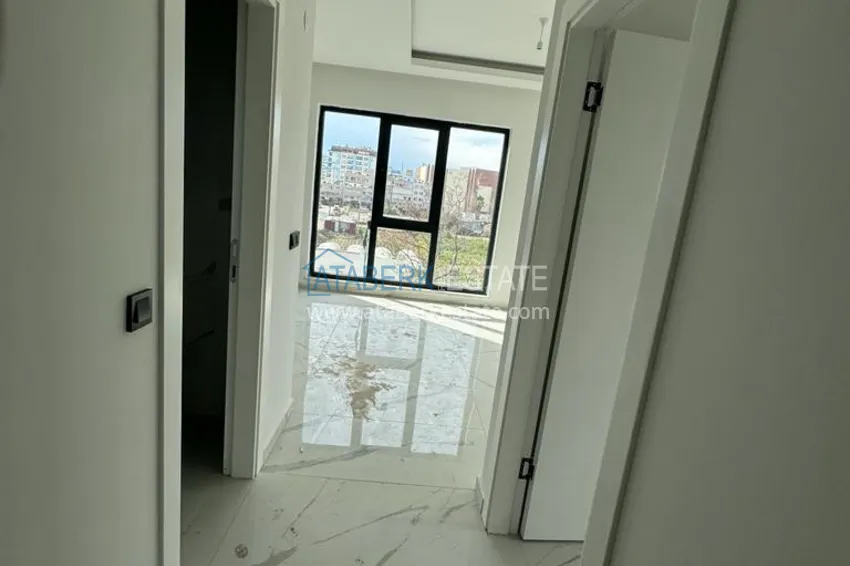 Приобрести Новостройки Алании. Двухкомнатная квартира с чистовой отделкой в районе Махмутлар 2