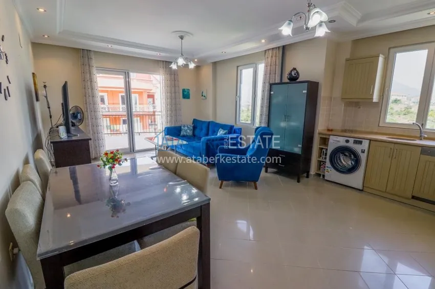 Приобрести Трехкомнатная квартира с мебелью и видом на море в Алании, район Тосмур 3 