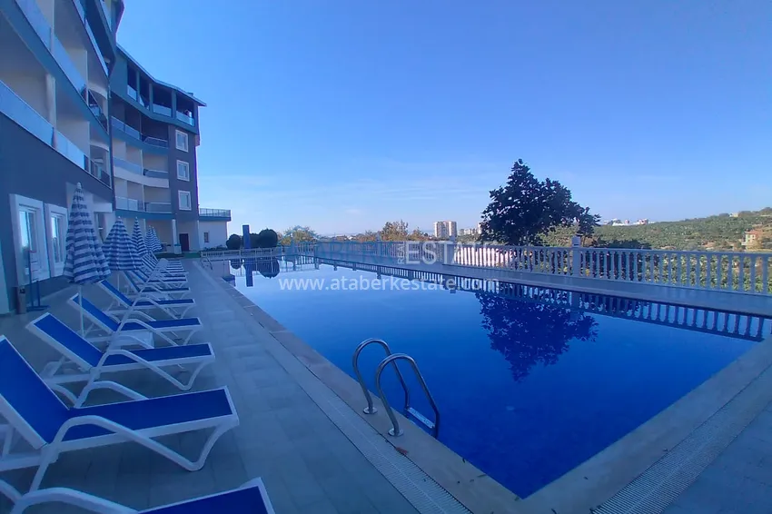 Квартира-студия с мебелью и боковым видом на море в Алании, район Каргыджак 4 