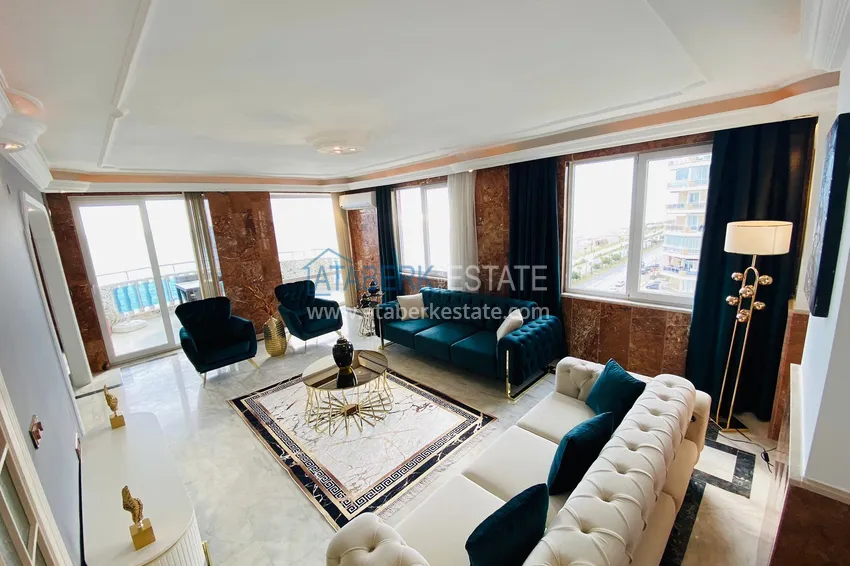 Приобрести Роскошный видовой дуплекс с дизайнерским ремонтом и новой мебелью на первой береговой в Махмутларе, Алания 7 