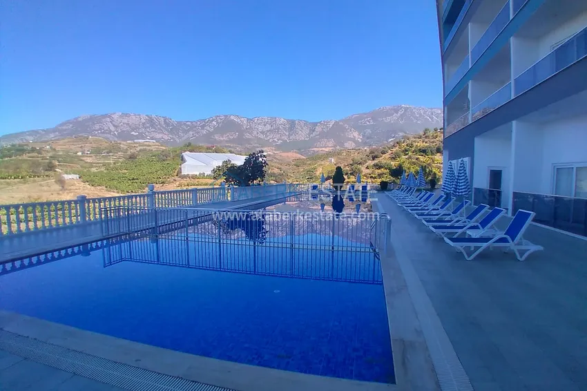 Квартира-студия с мебелью и боковым видом на море в Алании, район Каргыджак 5 