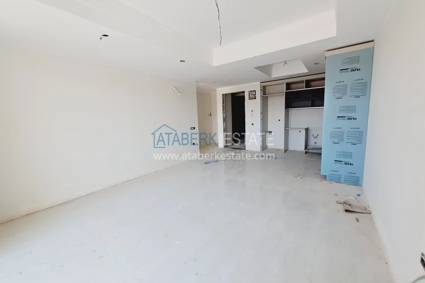 Приобрести Двухкомнатная квартира 85 м2 в строящемся комплекс-отеле в Алании, район Тюрклер 4 