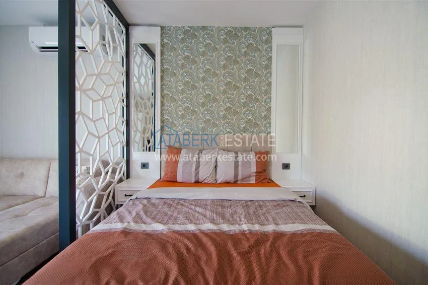 Приобрести Квартира-студия с мебелью и боковым видом на море в Алании, район Каргыджак 5 