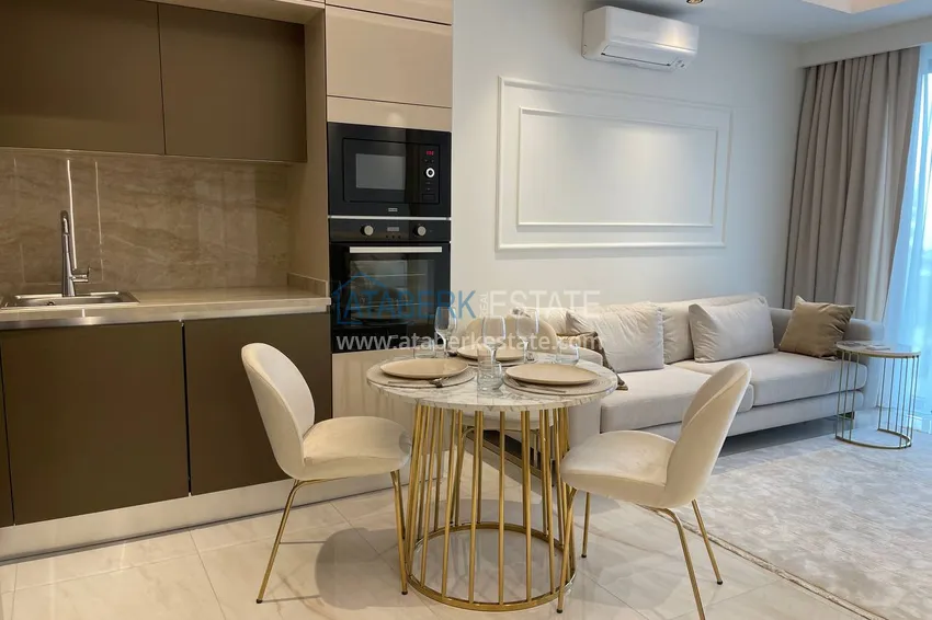 Приобрести Квартира под ключ с видом на море на первой береговой линии, в Алании, район Махмутлар 5 