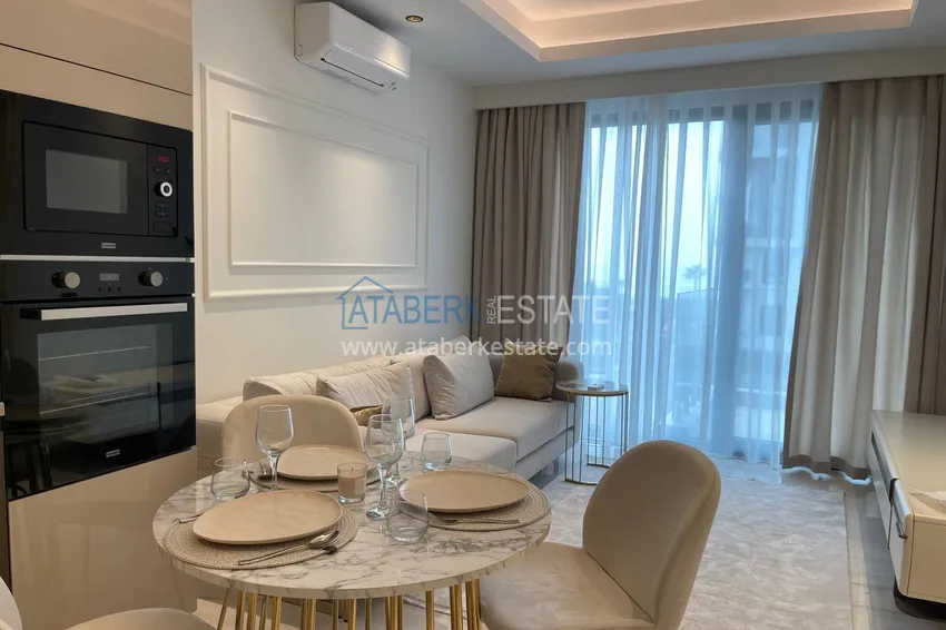 Приобрести Квартира под ключ с видом на море на первой береговой линии, в Алании, район Махмутлар 6 