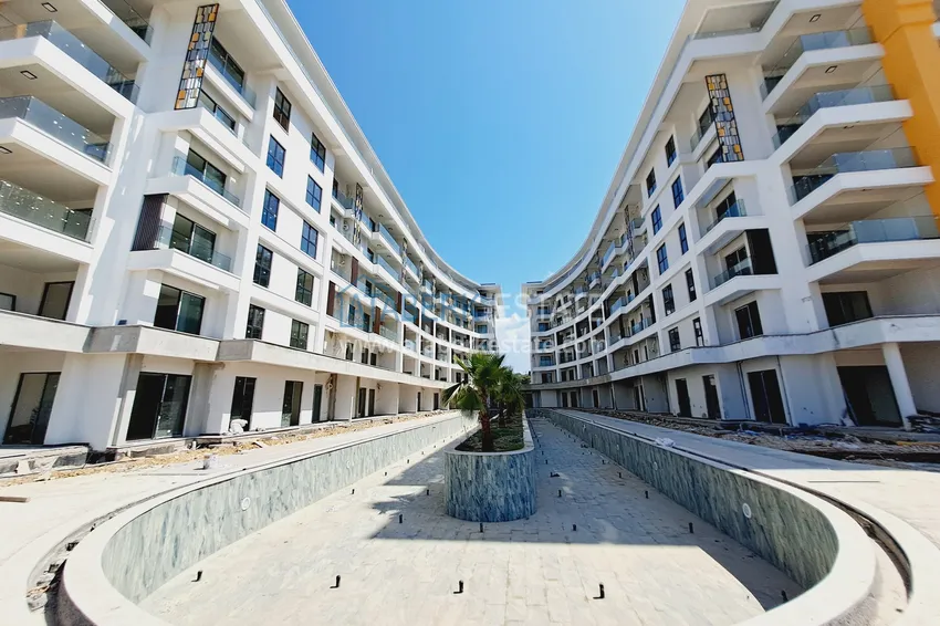 Фото -  Двухкомнатная квартира 85 м2 в строящемся комплекс-отеле в Алании, район Тюрклер 6 