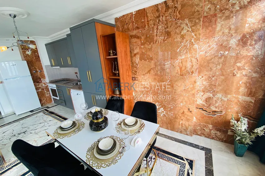 Приобрести Роскошный видовой дуплекс с дизайнерским ремонтом и новой мебелью на первой береговой в Махмутларе, Алания 12 