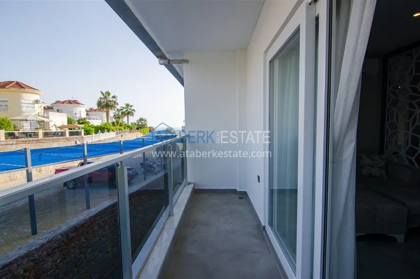 Приобрести Квартира-студия с мебелью и боковым видом на море в Алании, район Каргыджак 7 