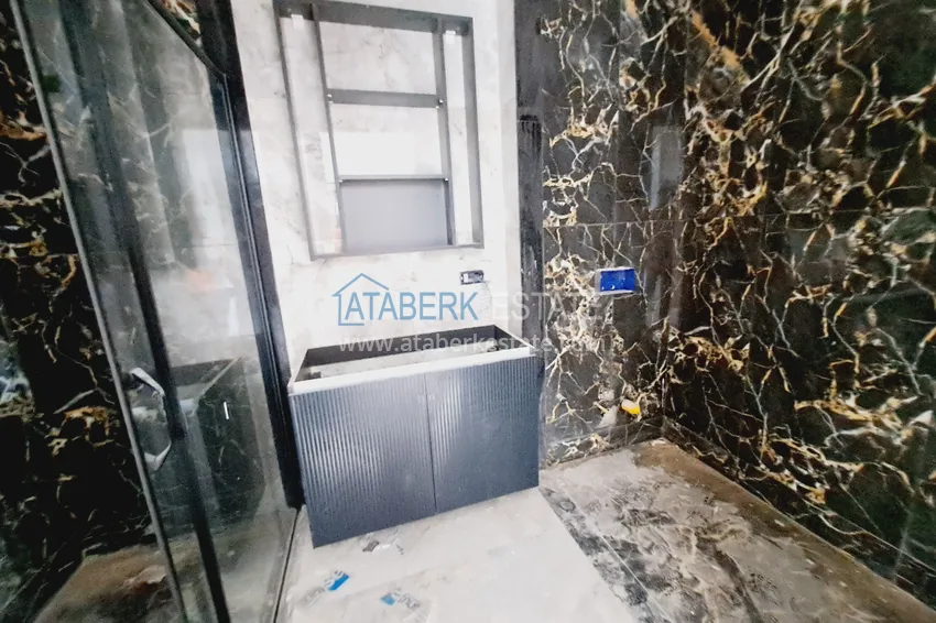 Приобрести Двухкомнатная квартира 85 м2 в строящемся комплекс-отеле в Алании, район Тюрклер 7 