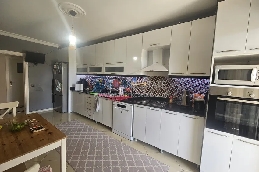 Приобрести Линейная четырехкомнатная квартира с отдельной кухней в районе Джикджилли, Алания 7 