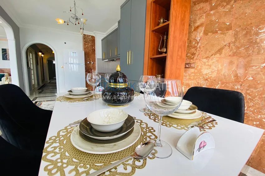 Приобрести Роскошный видовой дуплекс с дизайнерским ремонтом и новой мебелью на первой береговой в Махмутларе, Алания 13 