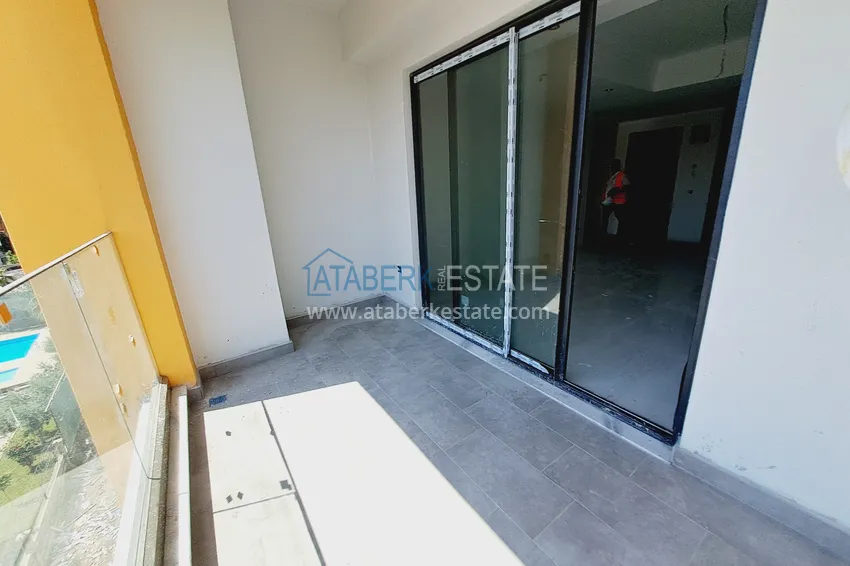 Приобрести Двухкомнатная квартира 85 м2 в строящемся комплекс-отеле в Алании, район Тюрклер 8 