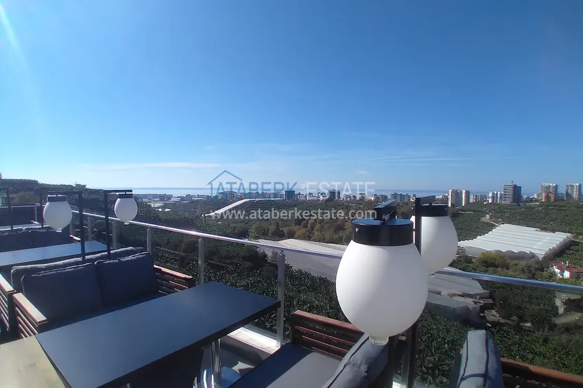 Квартира-студия с мебелью и боковым видом на море в Алании, район Каргыджак 11 