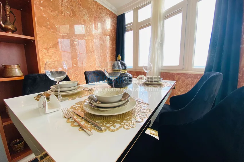 Приобрести Роскошный видовой дуплекс с дизайнерским ремонтом и новой мебелью на первой береговой в Махмутларе, Алания 14 