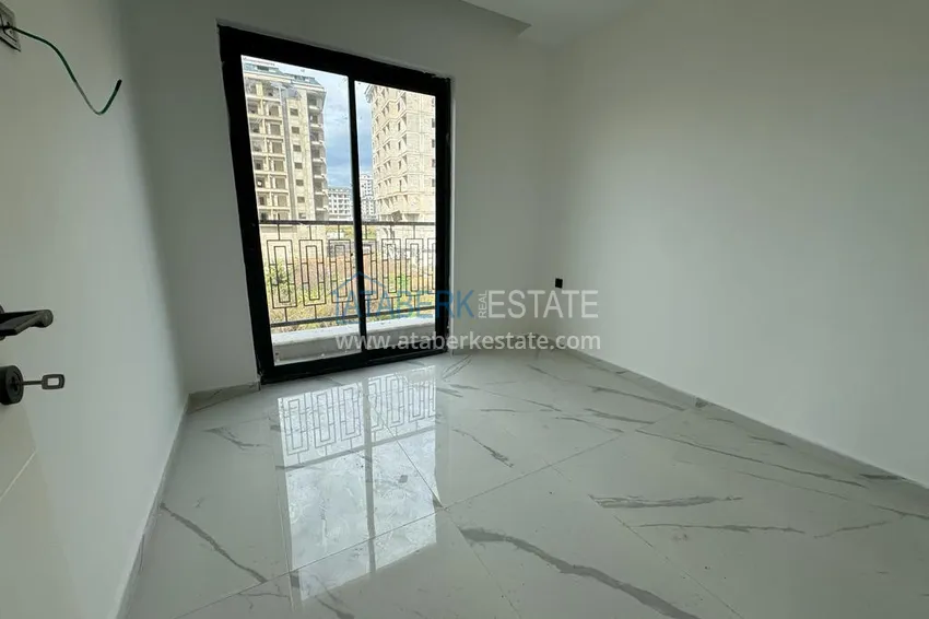 Приобрести Новостройки Алании. Двухкомнатная квартира с чистовой отделкой в районе Махмутлар 9