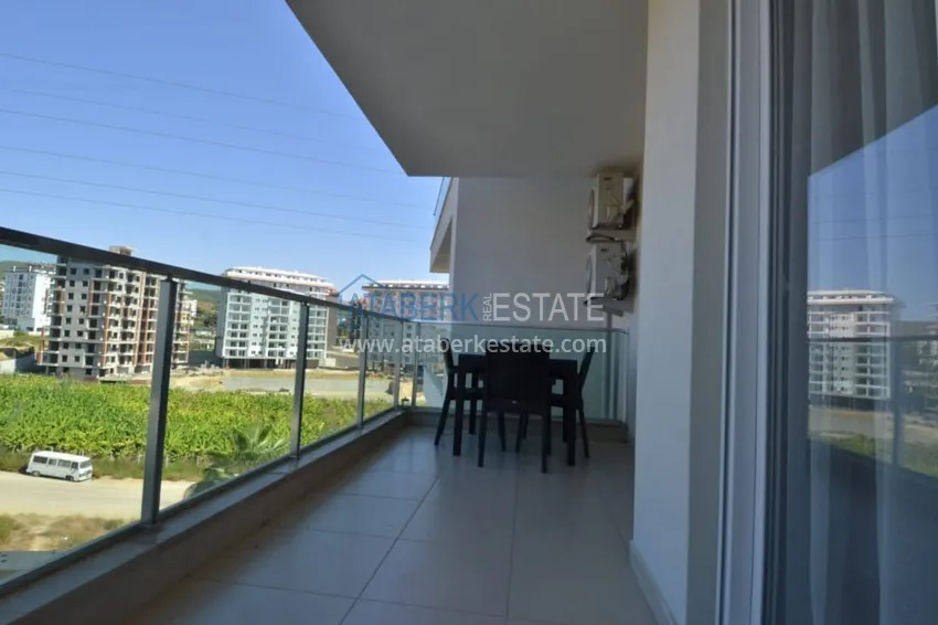 Приобрести Двухкомнатная квартира под ключ в комплексе с концепцией отеля – Алания, район Авсаллар 9 