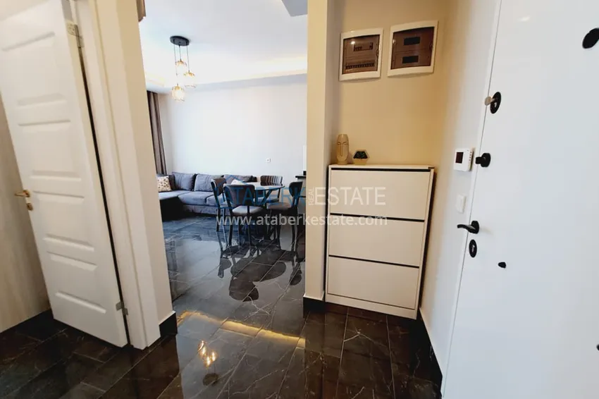 Приобрести Квартира 1+1 с мебелью и частичным видом на море, район Махмутлар – Алания 1 