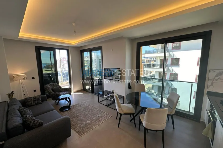 Приобрести Двухкомнатная квартира с мебелью, застекленным балконом и видом на море - Каргыджак, Алания 2 