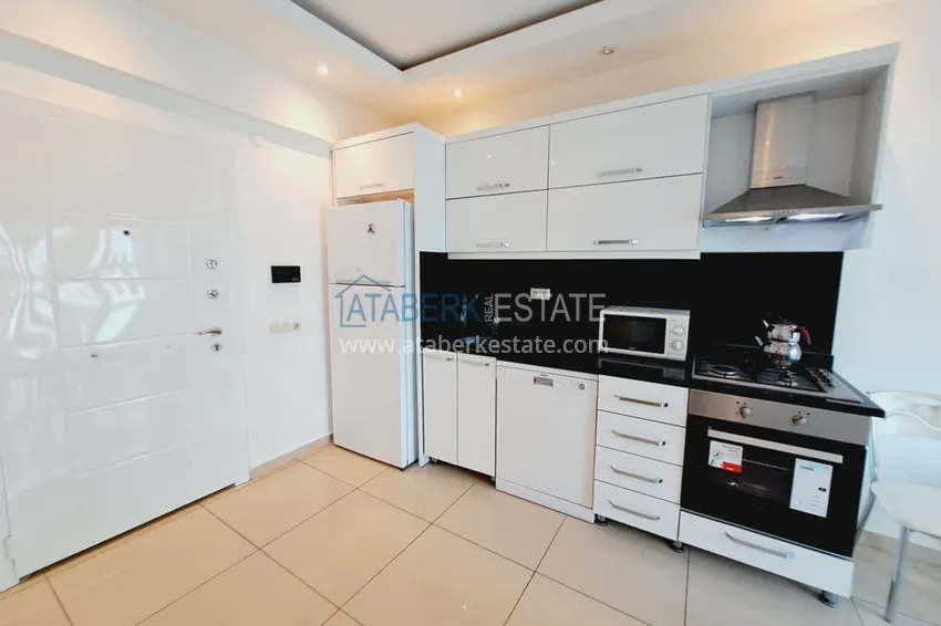 Приобрести Квартира 1+1 с мебелью и застеклённым балконом в центре Алании – район пляжа Клеопатра 3