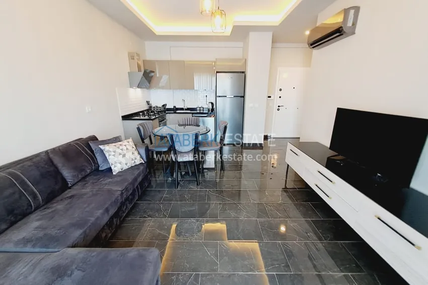 Приобрести Квартира 1+1 с мебелью и частичным видом на море, район Махмутлар – Алания 5 