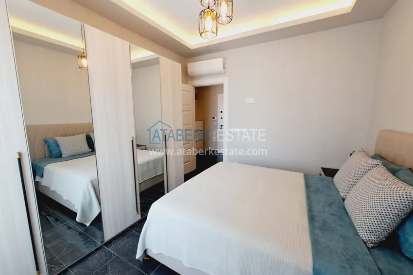 Приобрести Квартира 1+1 с мебелью и частичным видом на море, район Махмутлар – Алания 9 