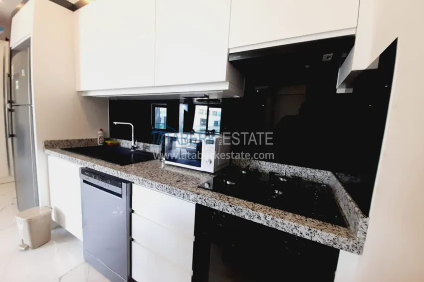 Приобрести Квартира 1+1 с мебелью и видом на море в комплексе на первой береговой – Алания, район Каргыджак 6 