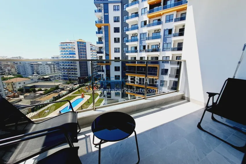 Приобрести Квартира 1+1 с мебелью и частичным видом на море, район Махмутлар – Алания 12 